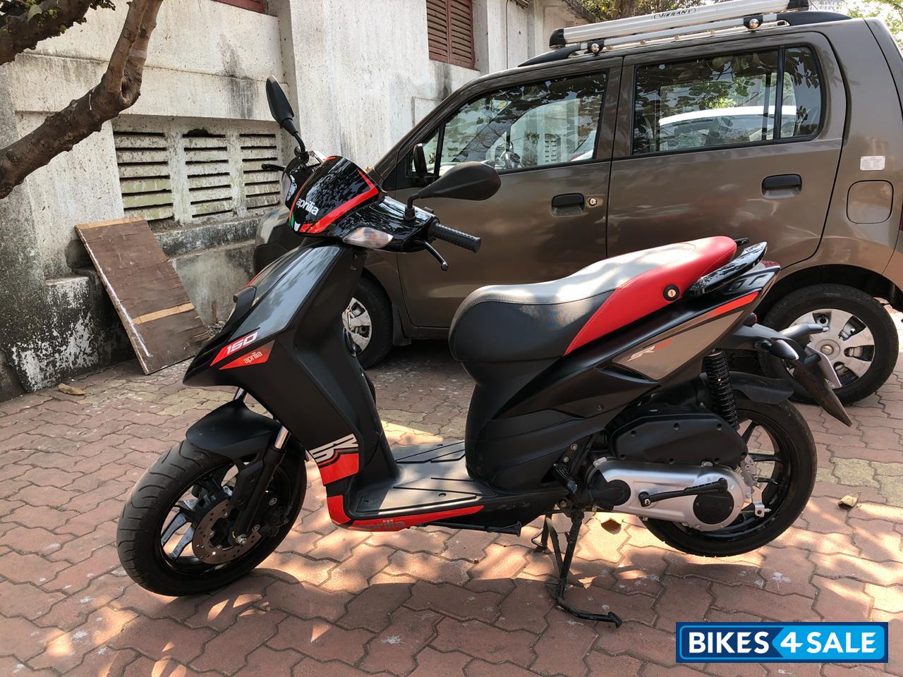 Black Aprilia SR 150