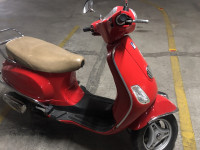 Cherry Red Vespa LX 125