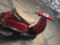 Cherry Red Vespa LX 125