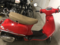 Cherry Red Vespa LX 125