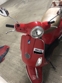 Cherry Red Vespa LX 125