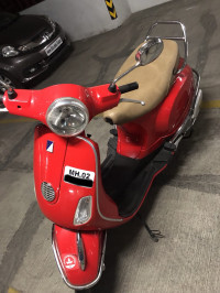 Cherry Red Vespa LX 125