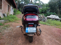 Purple Mahindra Gusto