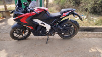 Red And White Bajaj Pulsar RS 200 ABS