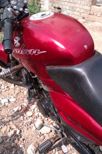 Red Bajaj Pulsar 150 Round Headlight