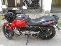 Red-black Bajaj Pulsar 150 DTSi