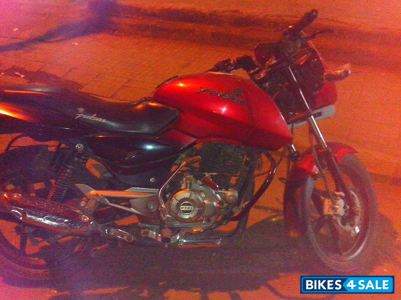 Red-black Bajaj Pulsar 150 DTSi