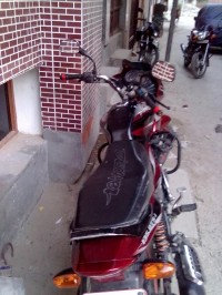 Red--black Bajaj Discover DTSi 135