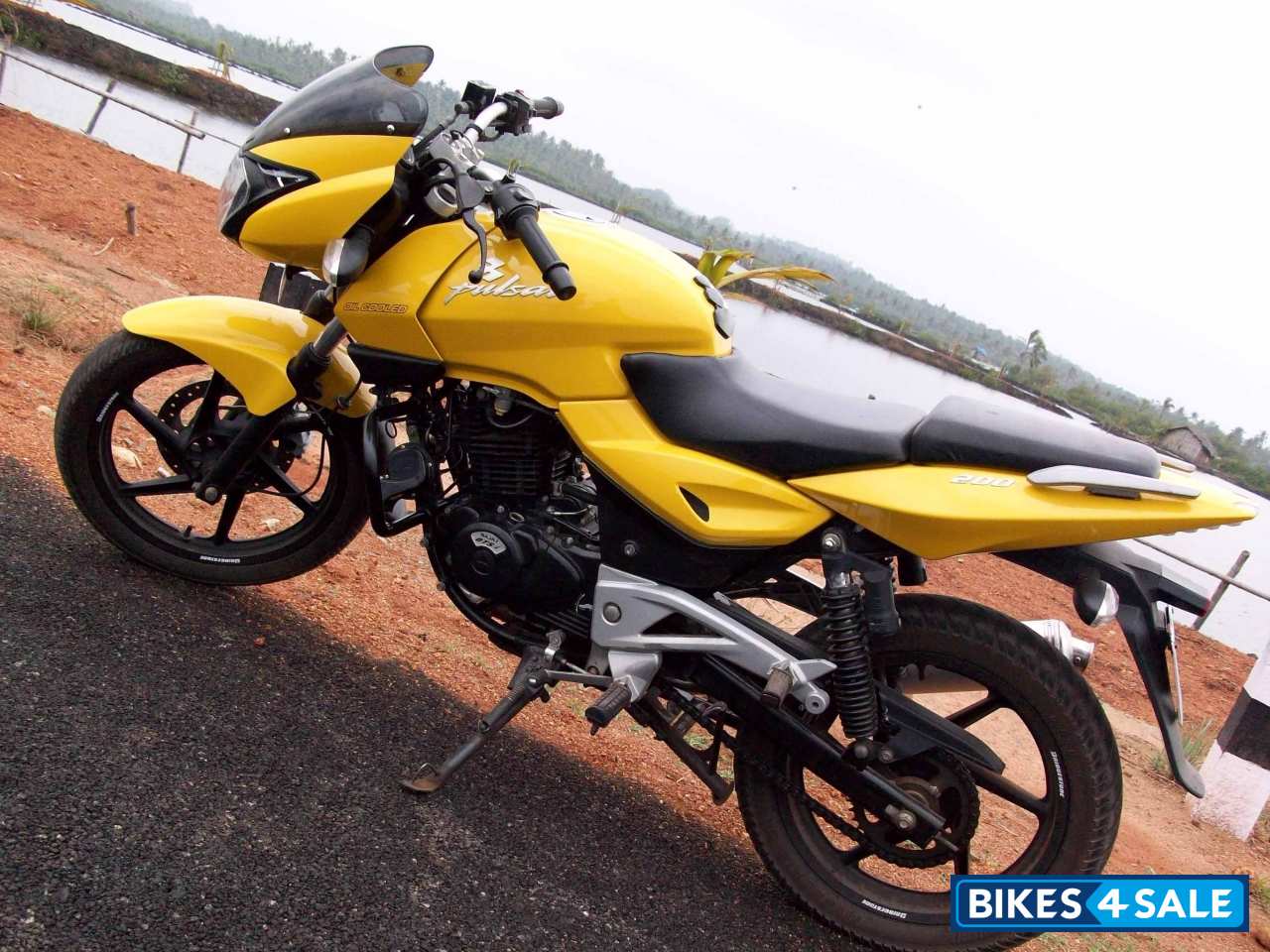 Yellow Bajaj Pulsar 200 DTSi